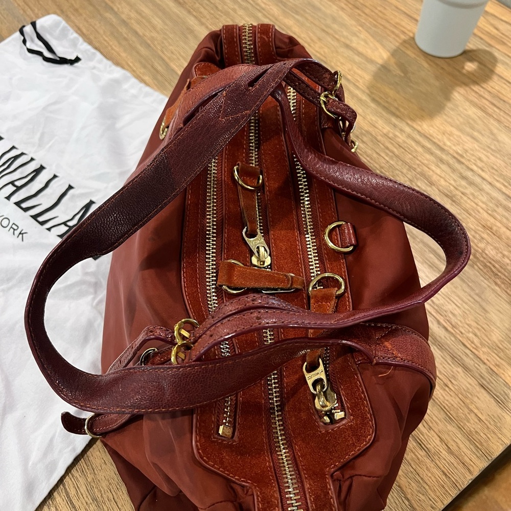 MZ WALLACE 9 inches tall. 13 inches long , deep red two strap bag.